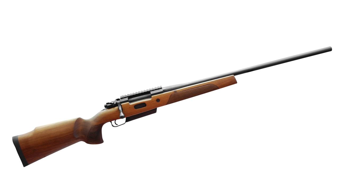 The side profile of a hunting rifle isolated against a white background. The rifle is a wooden and steel bolt-action model.